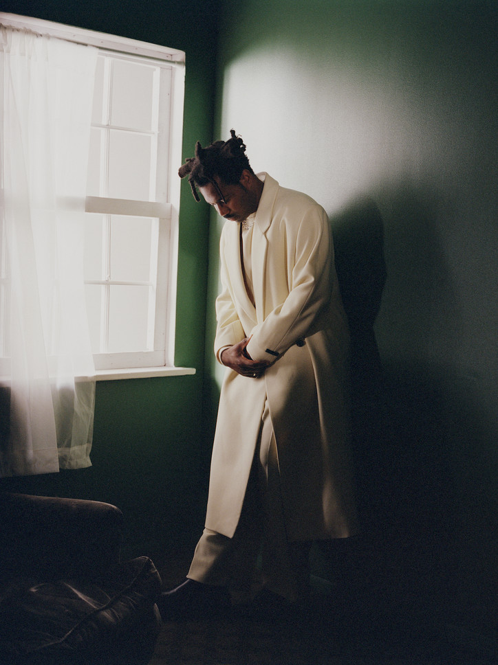 SAMPHA wears JACKET, TOP, PANTS by FEAR OF GOD, NECKLACE by ELIOU, SHOES by FERRAGAMO