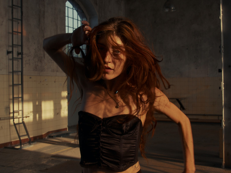 Girl with red hair dancing